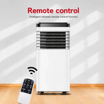 Portable air conditioner with remote control on a white background